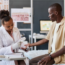 Side view medical scene with female dermatologist examining patient using magnifying glass in clinic